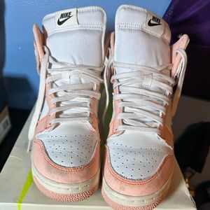 Woman’s high top Nike shoes